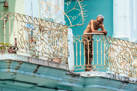 People on their balcony in Paseo de Marti in Havana, the capital of Cubaのeditorial素材