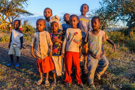 Kids from a Datoga tribe playing at sunset at Lake Eyasi, Tanzaniaのeditorial素材