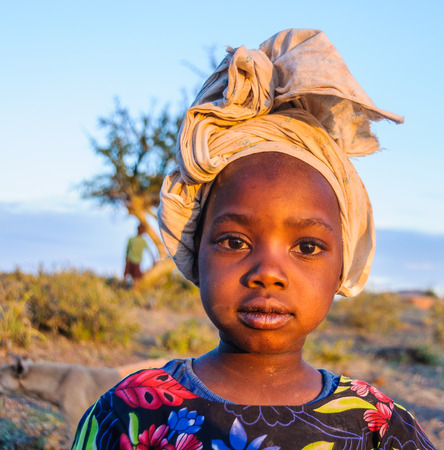 Kids from a Datoga tribe playing at sunset at Lake Eyasi, Tanzaniaのeditorial素材