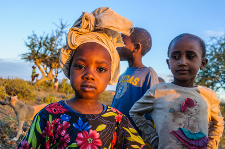 Kids from a Datoga tribe playing at sunset at Lake Eyasi, Tanzaniaのeditorial素材