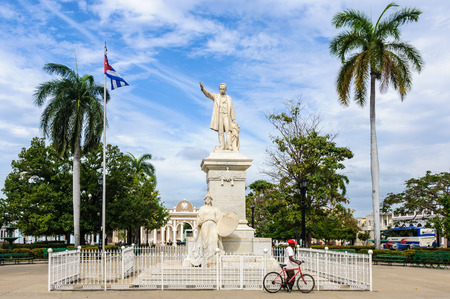 Jose Marti Statue in the park holding his name, the UNESCO World Heritage main square of Cienfuegos, Cubaのeditorial素材