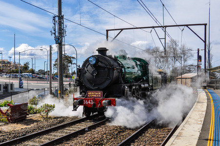 Steam engine arriving at Kattomba station in the Blue Mountains, Australia