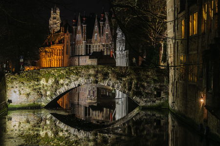 Night reflection in the UNESCO World Heritage Old Town of Bruges, Belgiumの写真素材