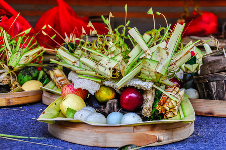 Offerings to the gods in the Tirta Empul Temple in Bali, Indonesiaの写真素材