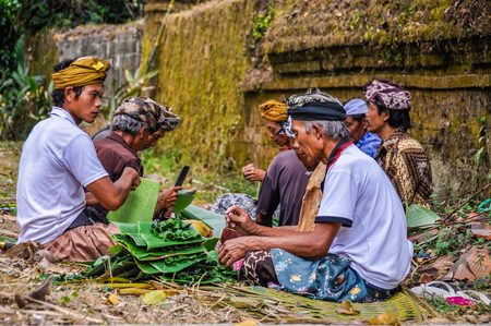 Balinese people preparing the offerings in the Tirta Empul Temple in Bali, Indonesiaのeditorial素材