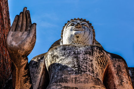 Standing Buddha statue in the Sukhotai Historical Park, Thailandの写真素材