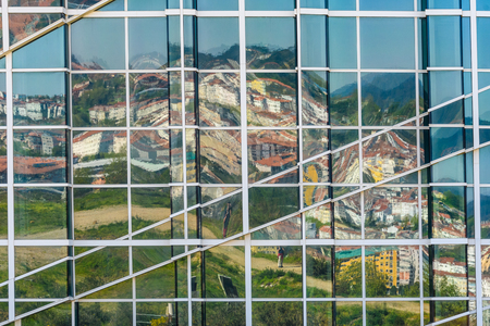 Mirror image in a modern building in GaiÃ¡s in Santiago de Compostela, Galicia, Spainの写真素材