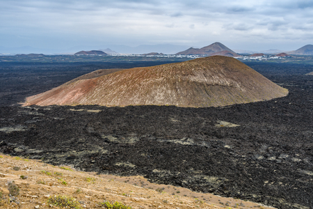 Volcanic cone  in the arid Timanfaya National Park, Lanzarote, Spainの写真素材