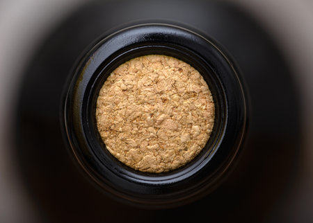 Top close-up view of bottle oak cork inside bottle of wine, not opened bottle of wineの写真素材