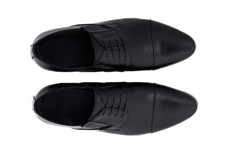 Black patent leather men shoes against white background. Male fashion with shoes on white.  The black man's shoes isolated on white background.の写真素材