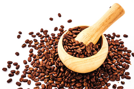Coffee beans in wooden bamboo mortar isolated on white background. coffee beans isolated on white background.の写真素材