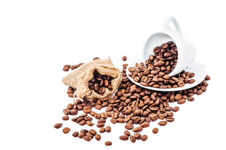 white cup with coffee beans isolatedの写真素材