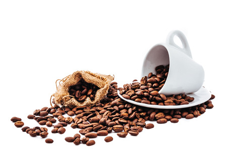 white cup with coffee beans isolatedの写真素材