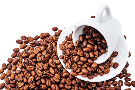 white cup with coffee beans isolatedの写真素材