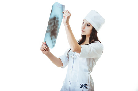 Medical doctor with x-ray image. Isolated over white background.の写真素材
