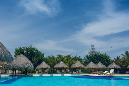 Outdoor resort pool Swimming pool of luxury hotel. Swimming pool in luxury resort near the sea. Tropical Paradise. Swimming pool in spa resort. Dominican Republic, Seychelles, Caribbean, Bahamas.のeditorial素材
