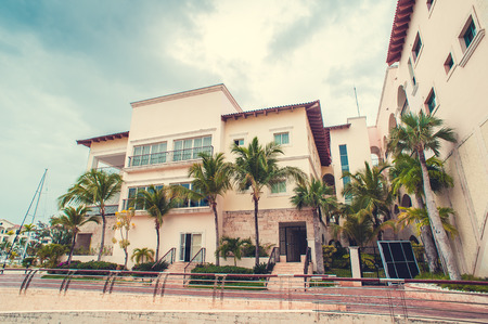 Luxury city on the water in Dominican Republic . Beautiful view of luxurious white yacht moored at sea bay.のeditorial素材