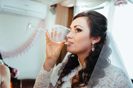 Young wedding couple indoors portrait. bride and groom on their wedding day.の写真素材