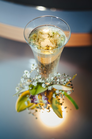 Wedding bouquet and champagne glass with flowers.の写真素材