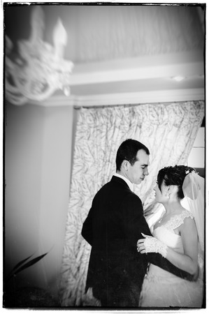 Wedding dance of charming bride and groom on their wedding celebration in a luxurious restaurant.の写真素材