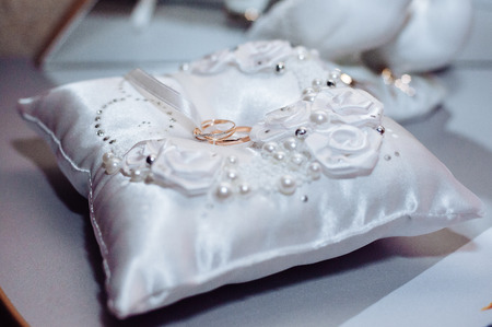 Two  weddings rings on a background a fabric.の写真素材