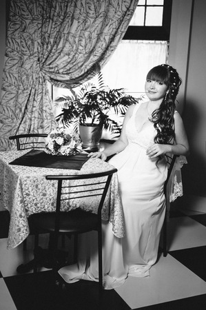 beautiful and fashion bride in luxury interior. Beautiful bride in a luxurious restaurant. Vintage style.の写真素材