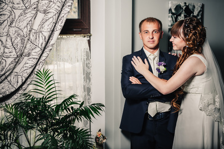 Charming bride and groom on their wedding celebration in a luxurious restaurantの写真素材