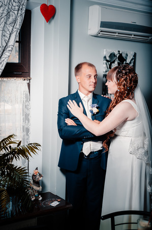 Charming bride and groom on their wedding celebration in a luxurious restaurantの写真素材