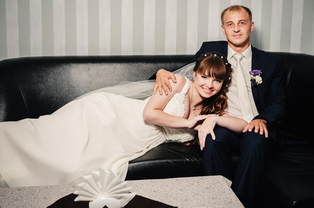 Charming bride and groom on their wedding celebration in a luxurious restaurantの写真素材