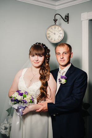 Charming bride and groom on their wedding celebration in a luxurious restaurantの写真素材