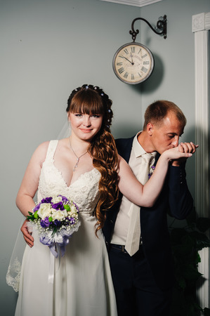Charming bride and groom on their wedding celebration in a luxurious restaurantの写真素材