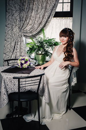 beautiful and fashion bride in luxury interior. Beautiful bride in a luxurious restaurant. Vintage style.の写真素材