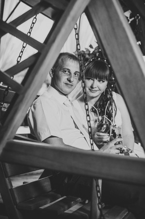 young bride and groom in the park, a wedding bouquet, wedding dresses.の写真素材
