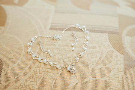 Heart made with silver chain isolated on white. Wedding jewelery bride decoration.の写真素材