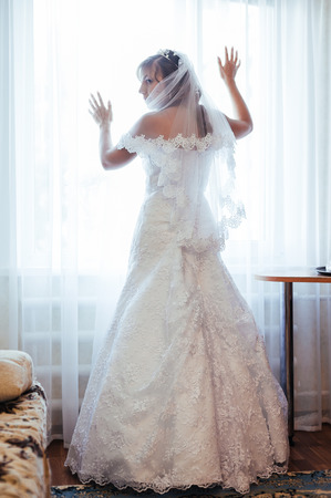 Beautiful caucasian bride getting ready for the wedding ceremony.の写真素材
