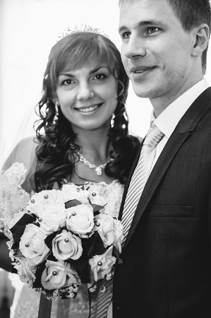 Handsome groom first time meets his bride at her house on a wedding dayの写真素材