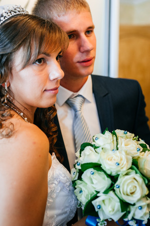 Handsome groom first time meets his bride at her house on a wedding dayの写真素材