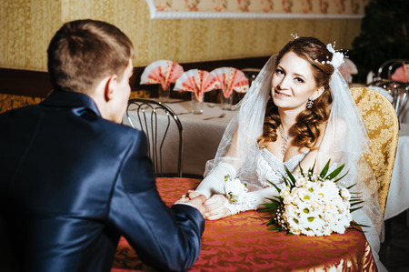 Love you honey.  Newly wed couple drinking cappuccino in cafe.の写真素材