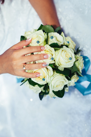 Portrait of a beautiful smiling bride posing in her wedding day.の写真素材