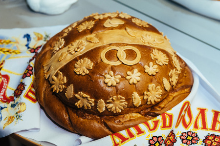 traditional ukranian wedding loaf. Delicious wedding bread and salt are ready for guests.の写真素材