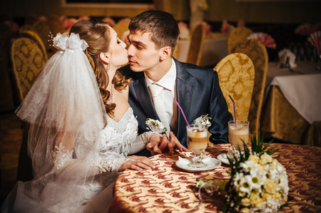 Love you honey.  Newly wed couple drinking cappuccino in cafe.の写真素材