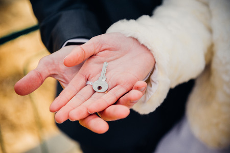 A wedding by the sea. Honeymoon. The bride and groom hugging on the shore of Lake. groom and bride hugging on a green lake. Groom and Bride in a park. wedding dress. Bridal wedding bouquet of flowersの写真素材
