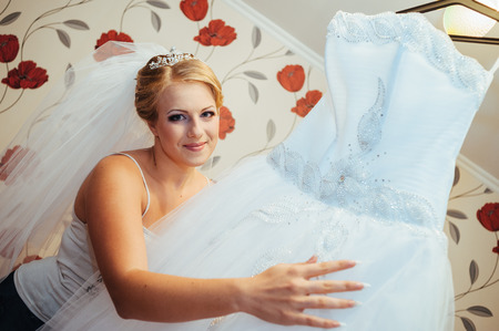 Beautiful caucasian bride getting ready for the wedding ceremony.の写真素材