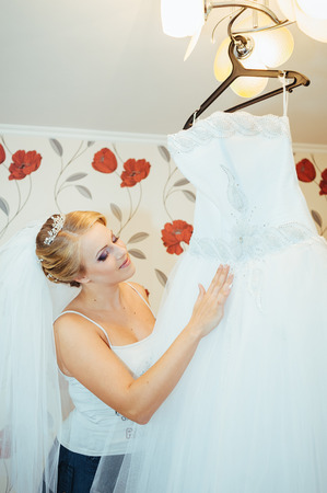 Beautiful caucasian bride getting ready for the wedding ceremony.の写真素材
