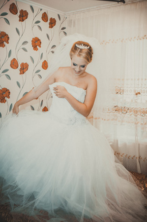 Beautiful caucasian bride getting ready for the wedding ceremony.の写真素材