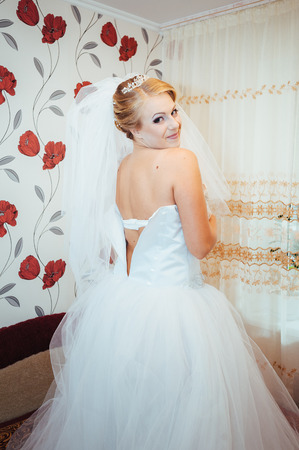 Beautiful caucasian bride getting ready for the wedding ceremony.の写真素材