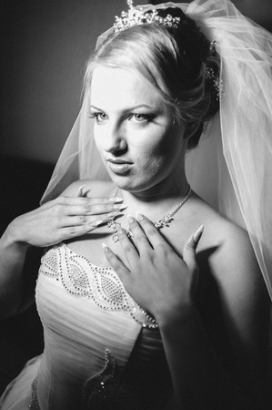 Beautiful caucasian bride getting ready for the wedding ceremony.の写真素材
