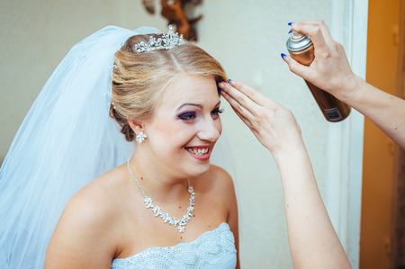 Beautiful caucasian bride getting ready for the wedding ceremony.の写真素材