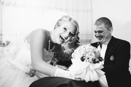 Handsome groom first time meets his bride at her house on a wedding day.の写真素材