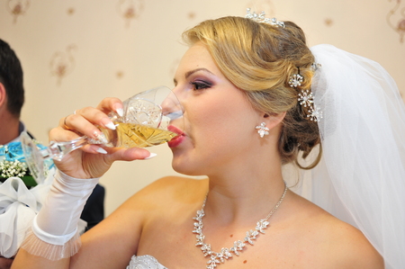 Bride and groom with glasses of champagne.の写真素材